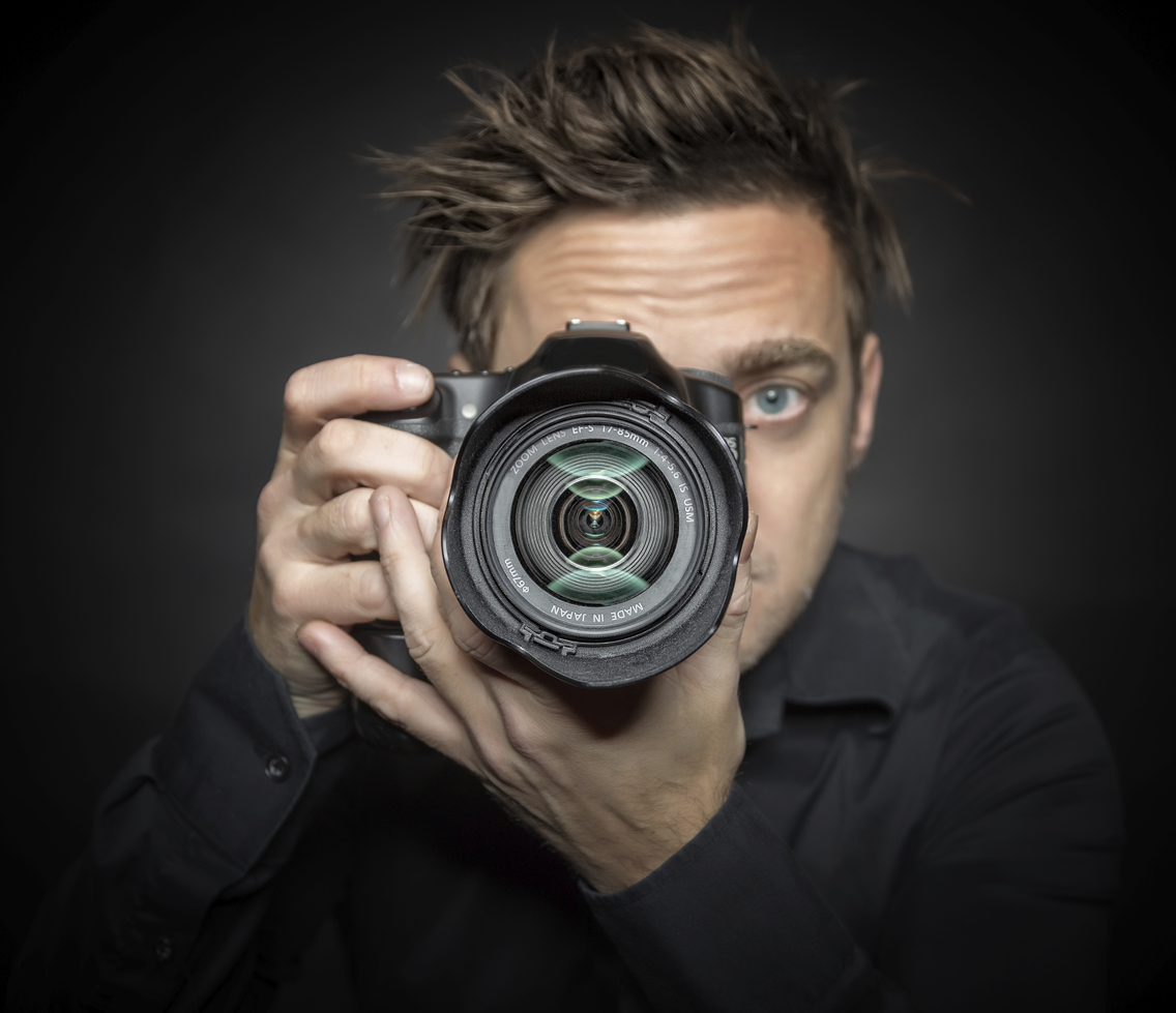 Photographer on a dark background